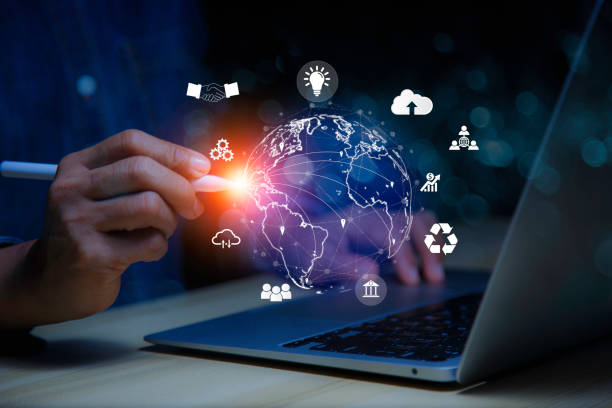 istock businessman sit and work on information technology networks internet connection Wireless devices around the world. Information technology , Ai Technology is Essential to Businesses in digital world. 1579768836