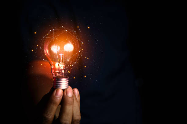 istock innovation ideas for success. Light bulb in businessman hand representing modern ideas and technology. Innovations and technologies that rely on information from the Internet, Big Data. 1579770910