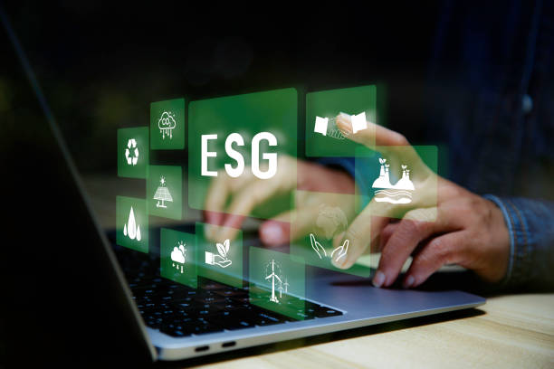 istock Businessman using laptop analyzing data Net zero in 2050 year for ESG eco concept environmental, social, sustainable, ethical. eco green energy system icon around ESG icon at home office background. 1579784489
