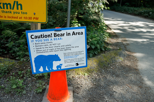 West Vancouver, Canada -May 20,2023: View of Warning sign Bear in Area inside the Lighthouse Park in West Vancouver