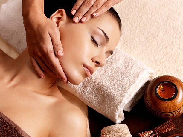 Woman having massage in the spa salon stock photo