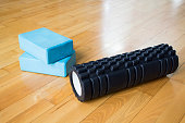 Sports equipment for kinesitherapy on a wooden floor in a gym