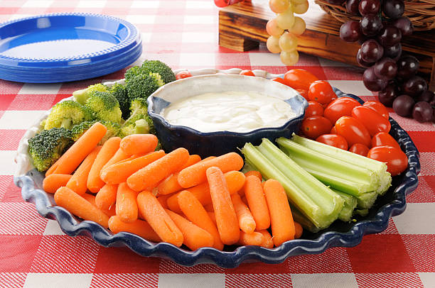 Vegetable platter with ranch dressing A healthy vegetable platter with ranch dressing on a picnic table broccoli crowns stock pictures, royalty-free photos & images