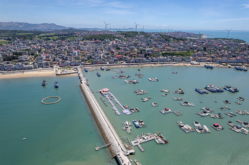 Aerial view of fishing town and port by the sea