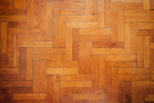 The surface of the teak wood (parquet) is brown with beautiful alternating patterns.