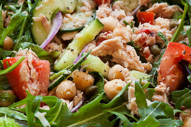 Tuna Salad Tuna salad with chickpeas and arugula.  Healthy eating. seafood salad stock pictures, royalty-free photos & images