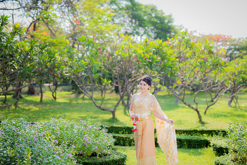 Traditional Thai costume, Beautiful Woman Asian Walk in Garden, Model: Thai-Chinese, 25-29 years, Thailand