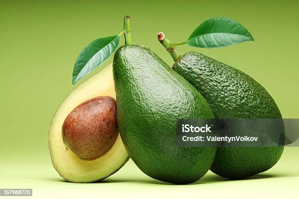 Three Avocados With One Sliced In Half Stock Photo - Download Image Now - Avocado, Seed, Cross Section