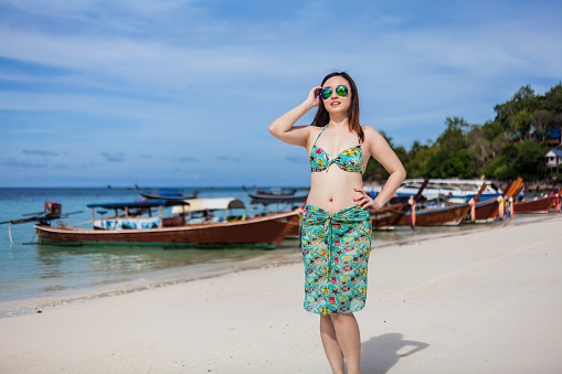 A young women posing in Beautiful Island of Koh Lipe with Sandy Beaches