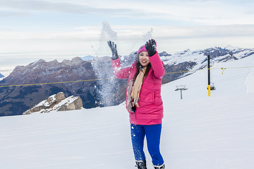 a young women posing in Switzerland Alps Snow Mountain of Mount Titlis