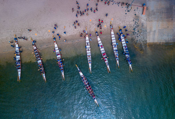 Dragon boats docking after a race
