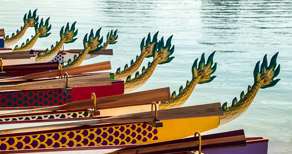 Dragon boats races are held in different countries with teams coming from various background to compete in a team sport.