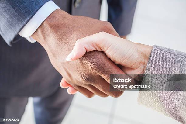 African American Businessman Woman Shaking Hands Stock Photo - Download Image Now - Handshake, Multiracial Group, Women