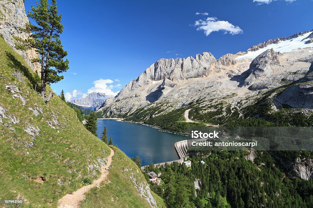 Dolomiti - Fedaia pass with lake summer view of mount Marmolada and Fedaia lake, Trentino, Italy Dam Stock Photo