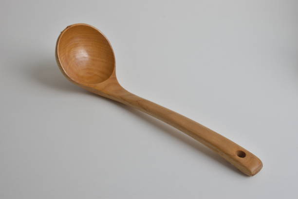 Wooden ladle on white background