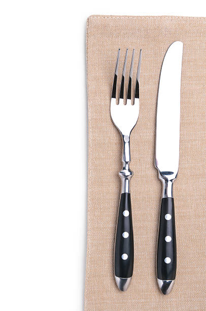 istock fork and knife on a flax napkin 157993724