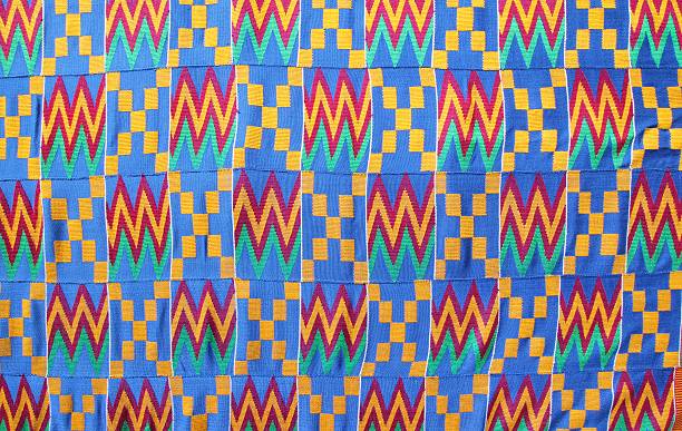 Kente Cloth, Ghana, West Africa Kente cloth are cotton fabrics made of interwoven cloth strips by the Akan tribe in Ghana and Ivory Coast. weaverbird photos stock pictures, royalty-free photos & images