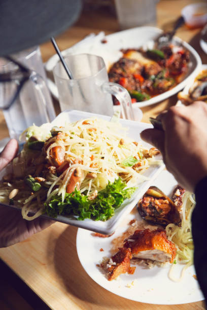 istock hand holds papaya salad 1579955083