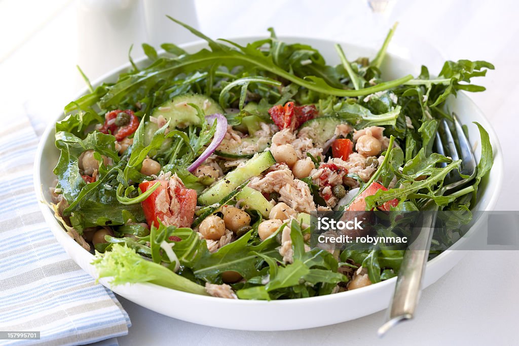 Tuna and Chickpea Salad Tuna salad with chickpeas, arugula, tomatoes, red onion and capers.  Delicious, low-fat healthy eating. Tuna - Seafood Stock Photo