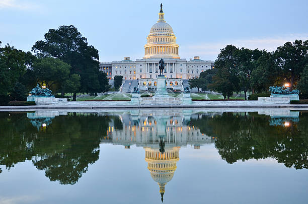 istock Washington DC, US Capitol building in a cloudy sunrise 157996236