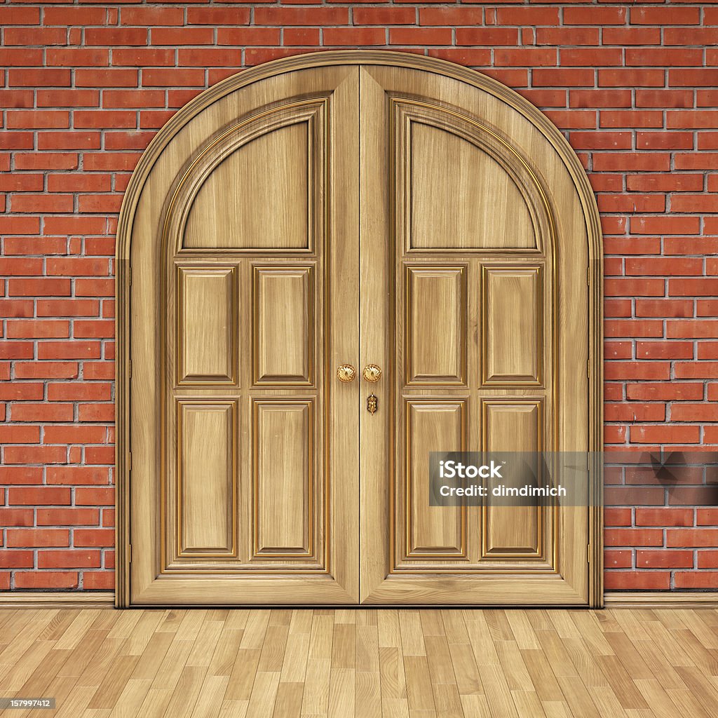 brick wooden door in a brick wall.interior with brick walls and wooden floors. Brick Stock Photo