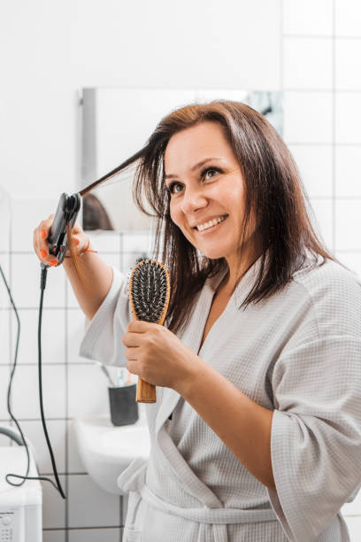 istock Woman using energy in the bathroom 1579999516
