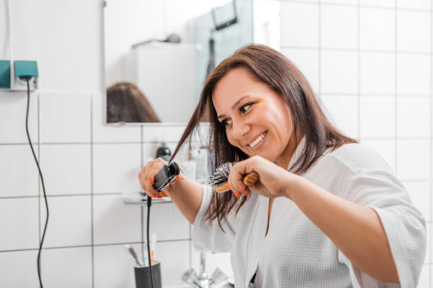 istock Woman using energy in the bathroom 1579999521