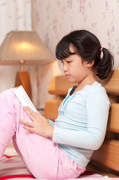 istock Asian girl reading 158000037
