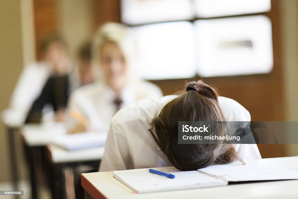 frustrated high school student frustrated high school student in classroom Sadness Stock Photo