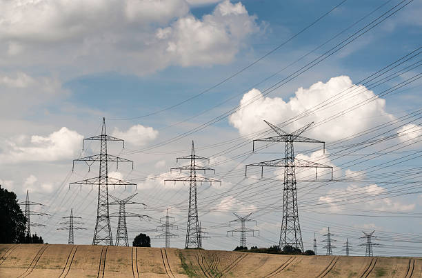 Electricity pylons in a agricultural landscape stock photo