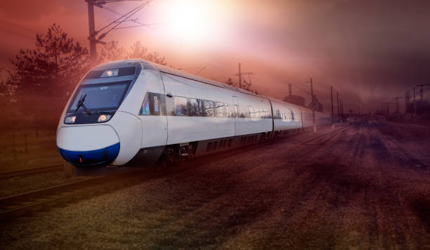 istock High speed train runs on rail tracks - The train is going too fast as a result the air pressure is causing too much heat at the front 1580048657