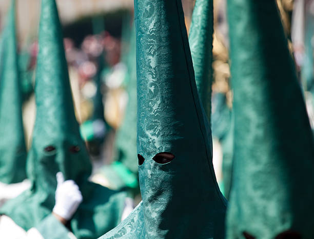 Nazarenos in procession during Semana Santa (Holy Week), April 2011, in Malaga, Spain