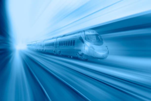 istock Blue high speed train runs on rail tracks - The train is going too fast as a result the air pressure is causing too much heat at the front 1580061162