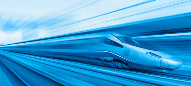istock Blue high speed train runs on rail tracks - The train is going too fast as a result the air pressure is causing too much heat at the front 1580064320