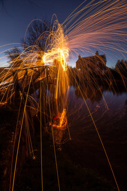 Light painting steel wool spinning near Guildford River Way footbridge Surrey England Europe