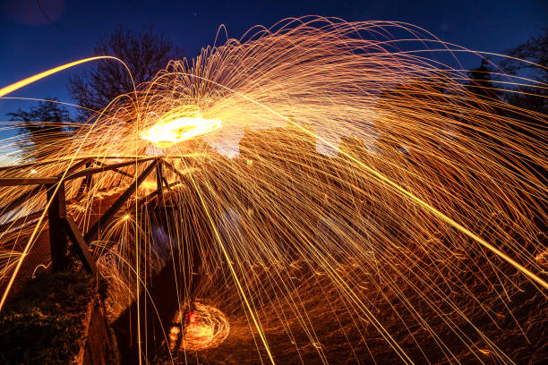 Light painting steel wool spinning near Guildford River Way footbridge Surrey England Europe