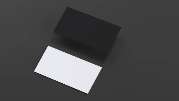 istock Two blank horizontal business cards mockup, black and white on black background 1580133479