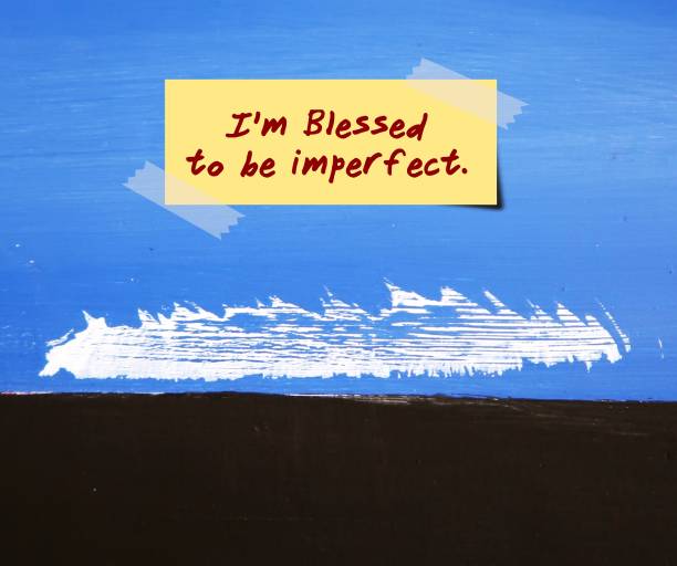 Painted wall with flaws and stick note written I AM BLESSED TO BE IMPERFECT with black copy space, concept of stop strive for perfection by accept imperfect self , embrace flaws and take pressure off life