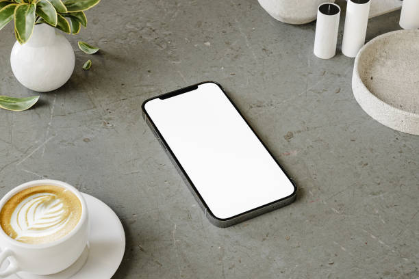 istock Mobile in a table with a cup of coffee 1580202375