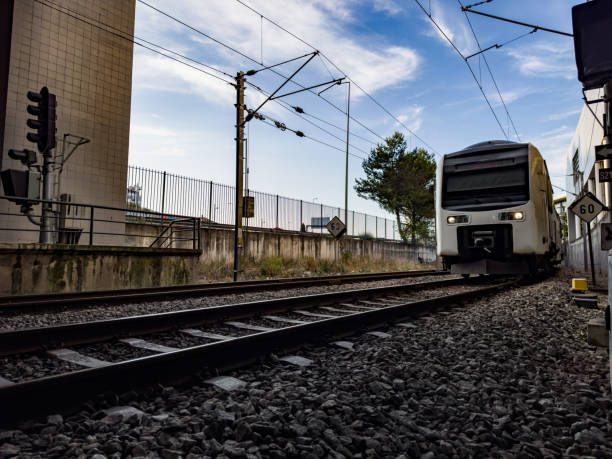 istock Image next to a train station platform with a passing train, in Lisbon, Portugal 1580210152