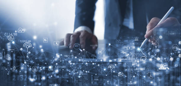 istock Digital marketing, IoT Internet of Things, Internet communication technology, business plan and strategy concept. Businessman using digital tablet with market research and smart communication icons 1580215941