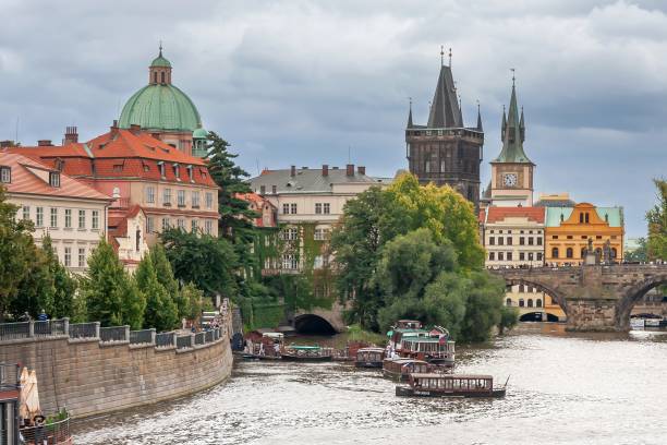 the four seasons pier, monastery of the crusaders with the red star, a dome of the st. francis of assisi church, old town bridge tower, and charles bridge - editorial dome sky cloud imagens e fotografias de stock