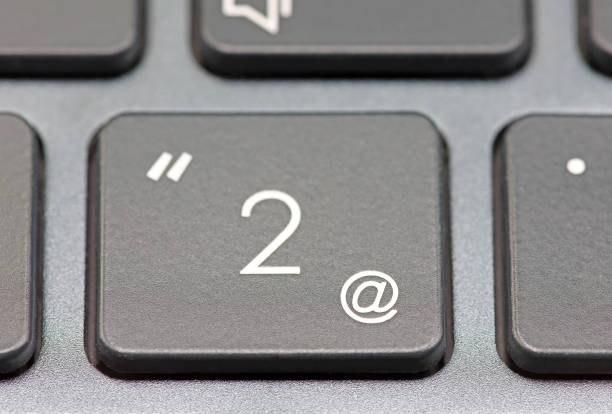 istock Selective focus on the @ of a laptop keyboard. 1580275494
