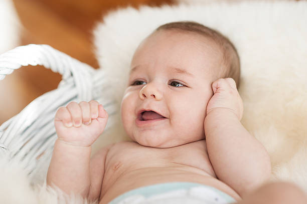 istock baby boy lying in basket close portrait 158029859
