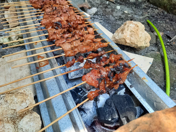 istock Cooking Grilled Barbecue Beef Satay (Sate Daging Sapi) On Charcoal Grill Stove 1580298841