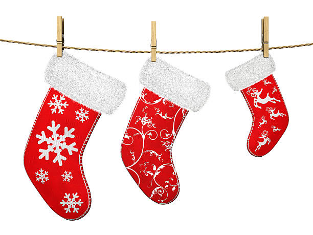 istock Three red Christmas stockings hanging on a line 158031115