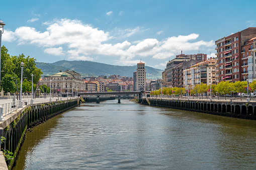 Promenade area of the River Nervion. In background the old city of Bilbao in front plane the river Nervion. Travel destination in North of Spain, Basque Country