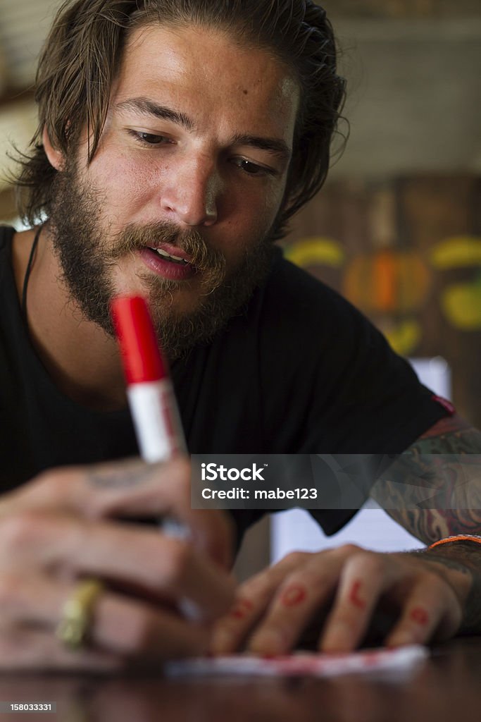 red pen young man with red pen Adult Stock Photo