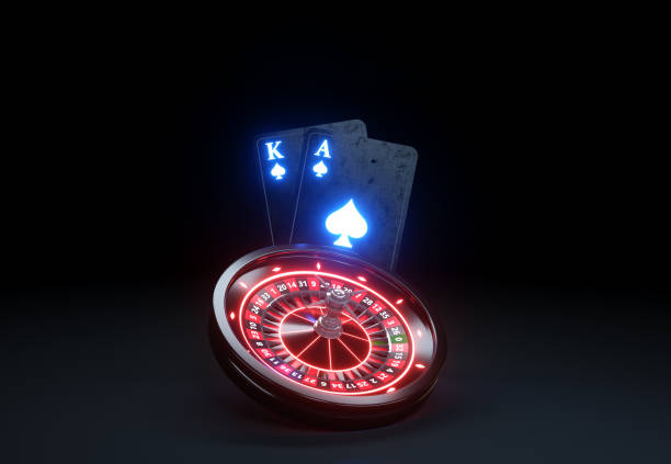 istock Playing Cards Black Jack and Roulette Wheel Concept With Red Neon Lights 1580333582