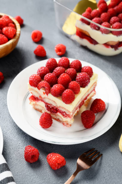 tiramisu dessert with fresh raspberry Summer tiramisu dessert with fresh raspberry and mascarpone cheese. yogurt fruit biscotti berry fruit stock pictures, royalty-free photos & images